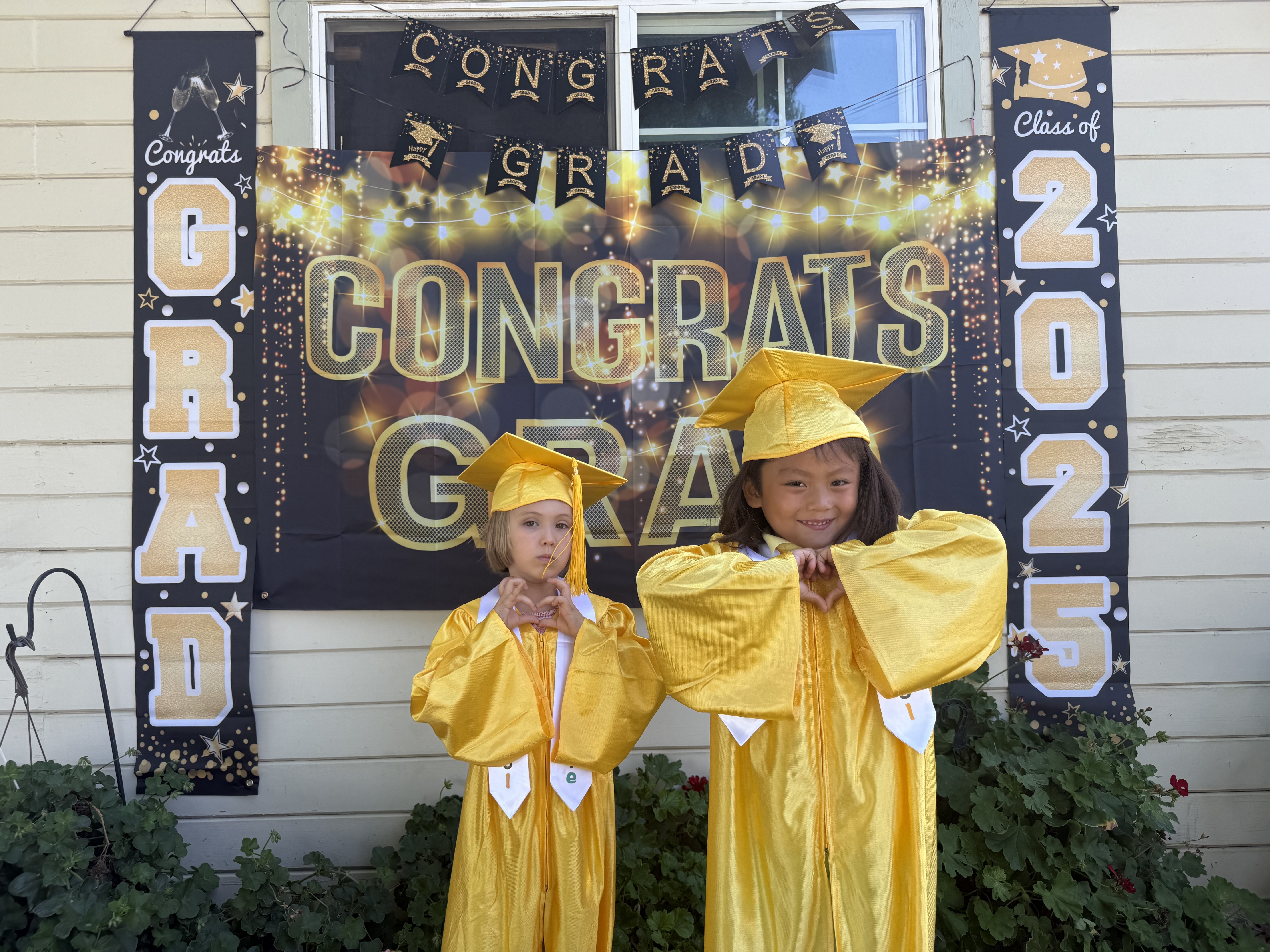 Apple Land Kids Pre-K Graduation Ceremony - Children in caps and gowns celebrating in Santa Clara